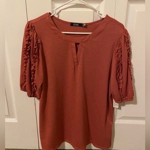 Coral Top with Ruffle Sleeve Detailing